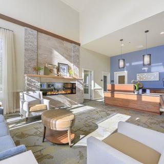 A modern and spacious lobby with contemporary furniture and bright lighting.