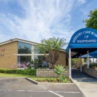 Exterior view of a building with an entrance awning labeled 'Skilled Care Center' and well-maintained landscaping.