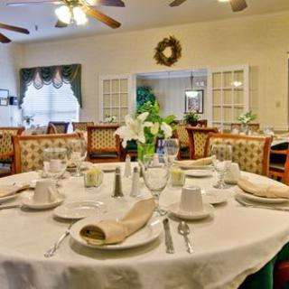 A beautifully set table in an elegant dining room, ready for guests.