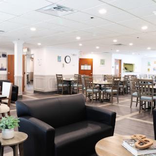A cozy dining area featuring comfortable seating and a modern design, perfect for social gatherings.