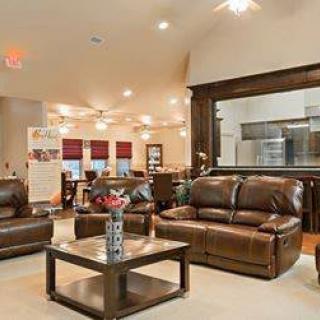 A modern living room with leather sofas and an open layout.