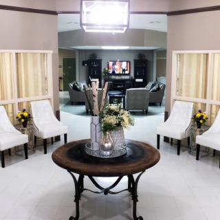 A modern living room with elegant furniture and decor.