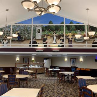 A spacious dining area featuring a ceiling mural and elegant chandeliers.
