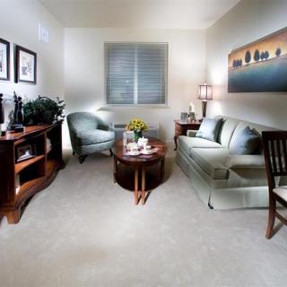 A cozy living room with comfortable seating and elegant decor.