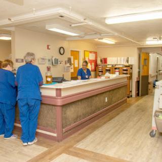 Reception area in a healthcare facility with medical staff at work.