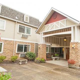The exterior view of a residential building with a covered entrance.
