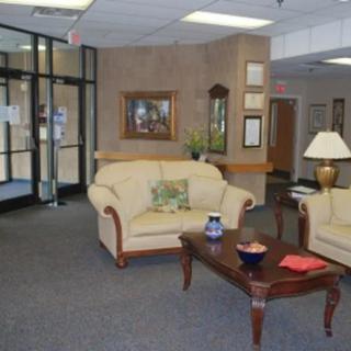 A cozy lobby area with sofas and a coffee table.