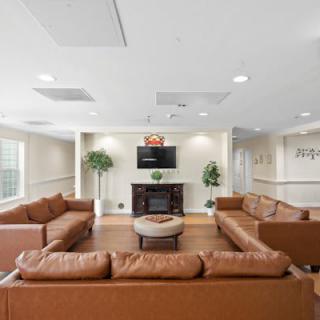 Spacious living room with comfortable seating and a television.