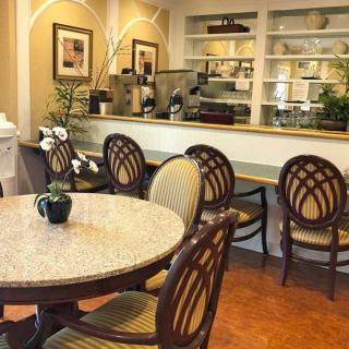 A cozy cafe interior with elegant furniture and decor.