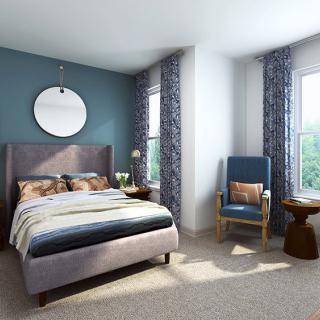 A modern bedroom with a comfortable bed, stylish furniture, and large windows letting in natural light.