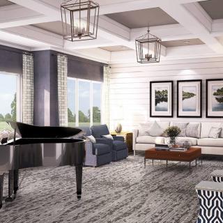 A stylish living room featuring a grand piano and cozy seating areas.