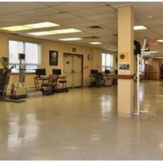 An indoor fitness facility equipped with various exercise machines.