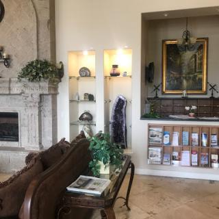 A welcoming lobby featuring elegant furniture, decorative elements, and a cozy fireplace.
