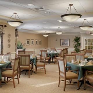 A well-decorated dining area with neatly arranged tables and comfortable seating.