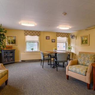 A cozy living room with comfortable seating and natural light.