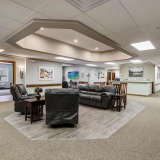 A spacious office waiting area with comfortable seating and modern decor.