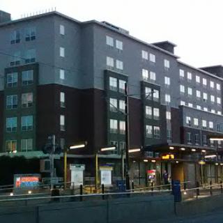 An urban building viewed during the evening, showcasing modern architectural design.