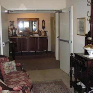 A hallway featuring antique furniture and traditional decor.