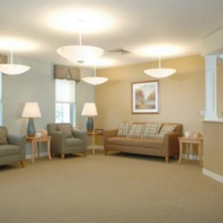 A spacious waiting room with comfortable seating and soft lighting.