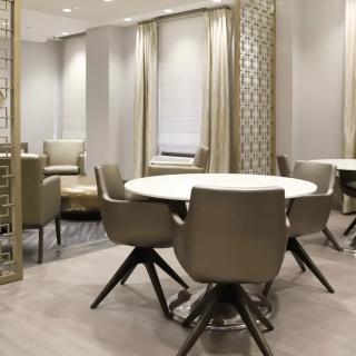 A contemporary dining area with elegant furniture and a stylish interior design.