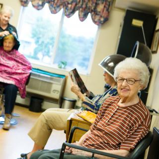 Elderly women enjoying a day at the hair salon in a community setting.