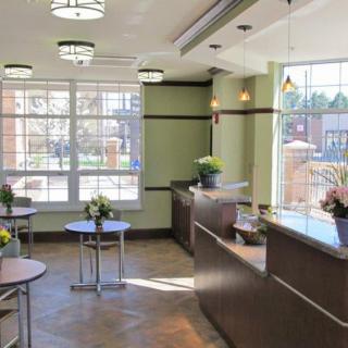 A modern reception area with natural lighting and contemporary furnishings.