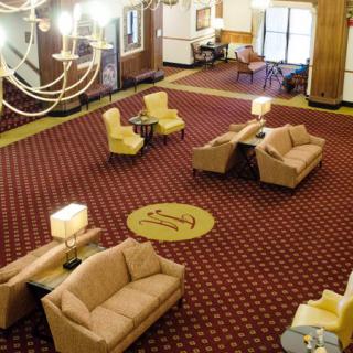 A spacious hotel lobby with comfortable seating and elegant decor.