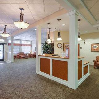 A welcoming reception area with warm lighting and comfortable seating.