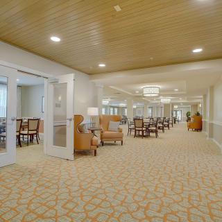 A spacious and well-lit lobby area featuring comfortable seating and elegant decor.