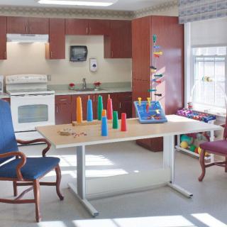 A therapy room equipped with exercise equipment and a rehabilitation area.
