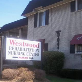 Exterior view of the Westwood Rehabilitation Nursing Center with a visible sign.