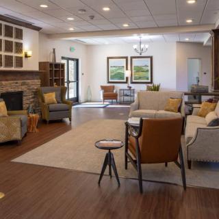 A modern and cozy living room with comfortable seating and stylish decor.