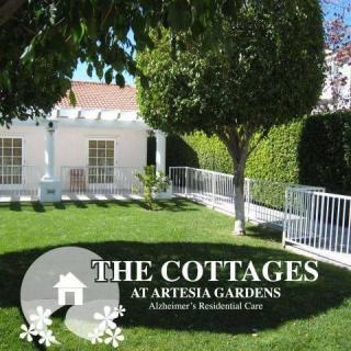 The Cottages at Artesia Gardens - A serene residential care facility with lush green lawns and trees.