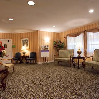A cozy and well-decorated living room with elegant furniture and soft lighting.
