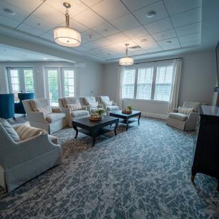 A spacious living room with comfortable seating and elegant decor.