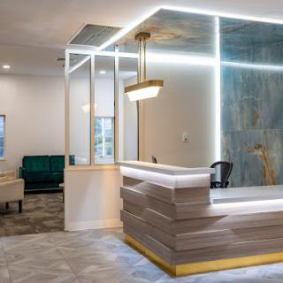 A modern reception area featuring sleek design elements and stylish furnishings.