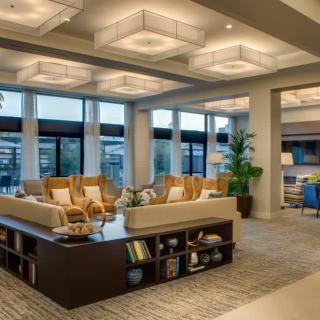 A modern living room with stylish lighting and comfortable seating.