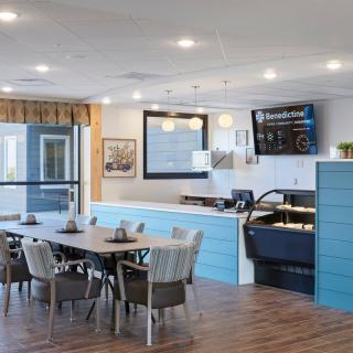 A modern dining area with stylish furniture and ambient lighting.