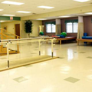 A rehabilitation center with exercise equipment and therapy areas.