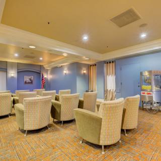 A cozy lounge area with comfortable seating and warm lighting.