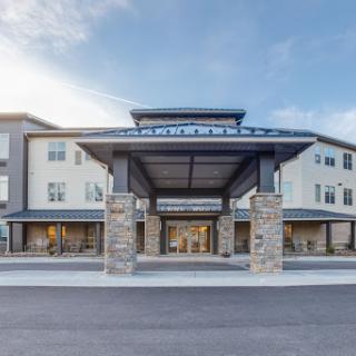The modern entrance of a hotel featuring contemporary architectural design.