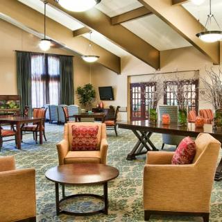 A cozy lounge area with comfortable seating and warm lighting.