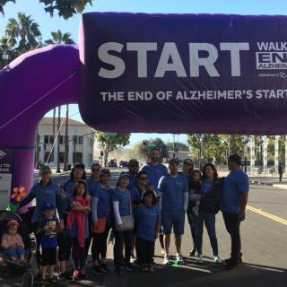 A group of people gathered at the starting point of a walk to end Alzheimer's.