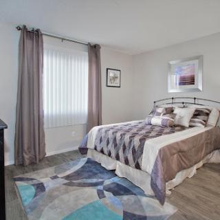 A cozy and modern bedroom featuring stylish decor.