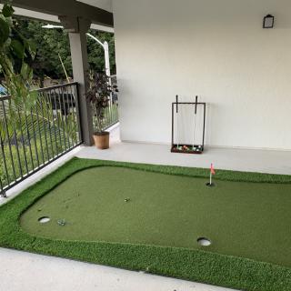 Indoor putting green setup for golf practice.