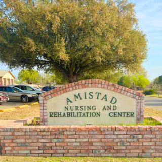 Entrance sign for Amistad Nursing and Rehabilitation Center.