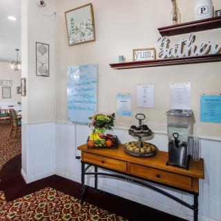 A welcoming lobby area with refreshments and decorative elements.
