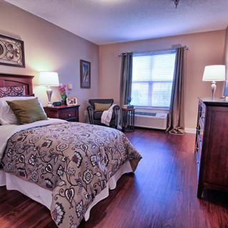 Cozy bedroom with a single bed and elegant decor.
