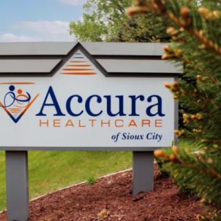 A sign for Accura Healthcare of Sioux City situated outdoors.