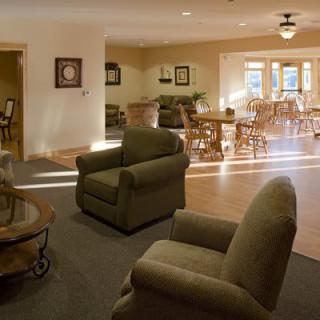 A cozy living room with comfortable seating and natural lighting.